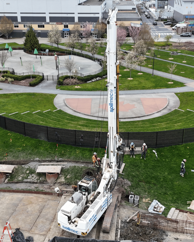 Aerial view of TerraCana drilling rig operating in the landscaped grounds of the Langley Events Centre with circular plaza and green space visible