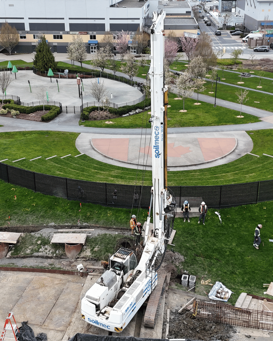 Aerial view of TerraCana drilling rig operating in the landscaped grounds of the Langley Events Centre with circular plaza and green space visible